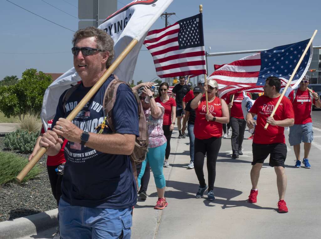<p>David Lindsey, a Dallas fire fighter, and other team members from Carry the Load West Coast Team were joined in Midland by Pioneer employees 05/17/19 to help walk and raise awareness and funds honoring and</p>